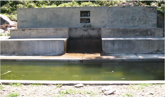 Concrete water tank full of water
