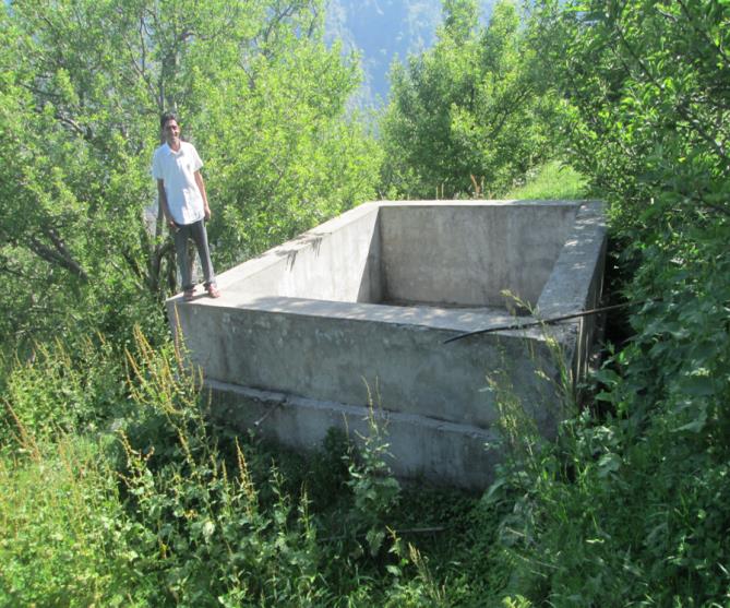 Water tank in an orchard
