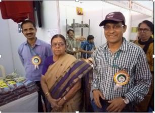 Exhibitors wearing badges