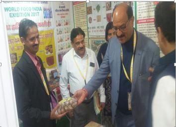 Officials visiting the stall at World Food India